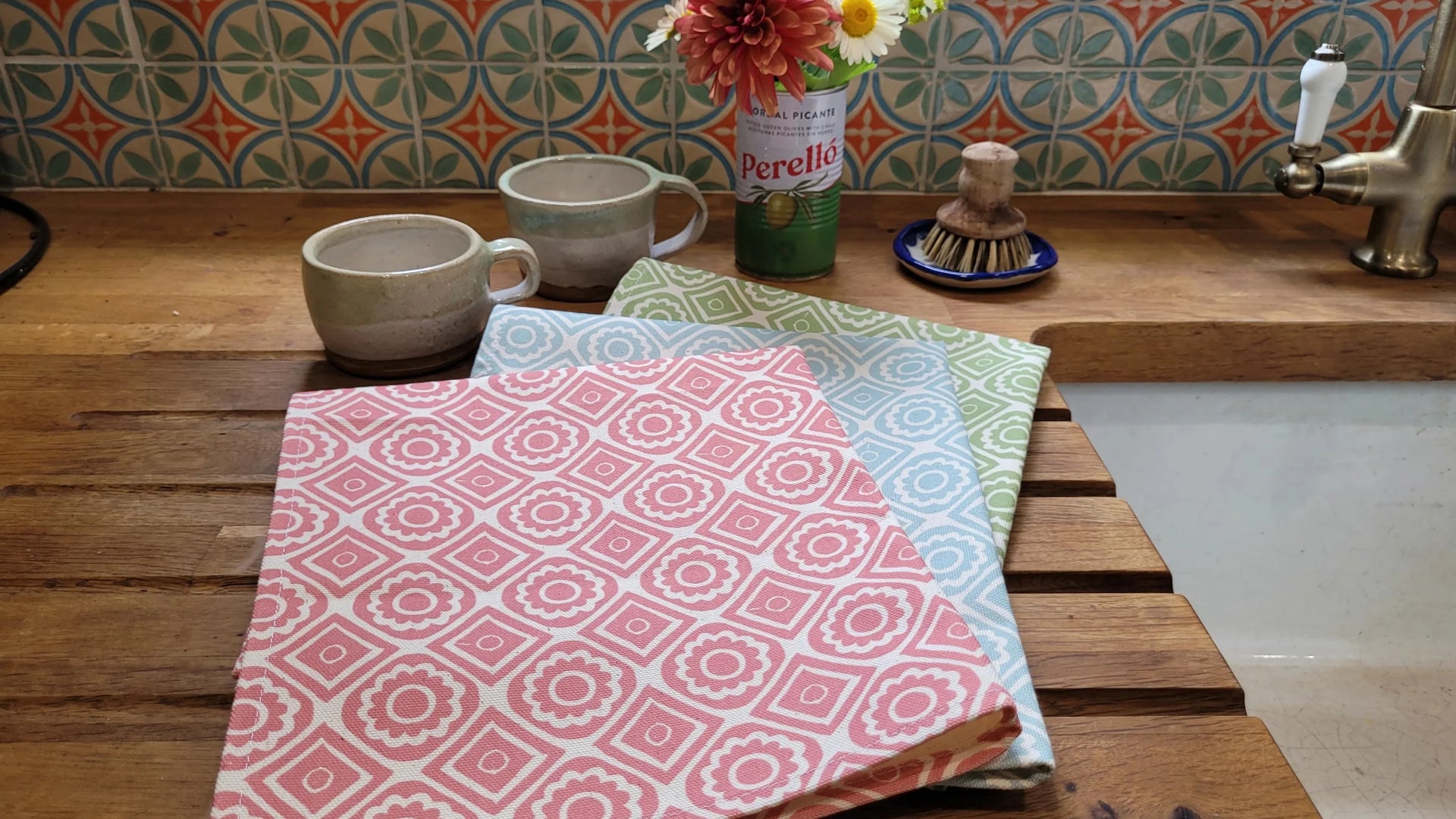 lino cut printed tea towels designed by lizzie mabley