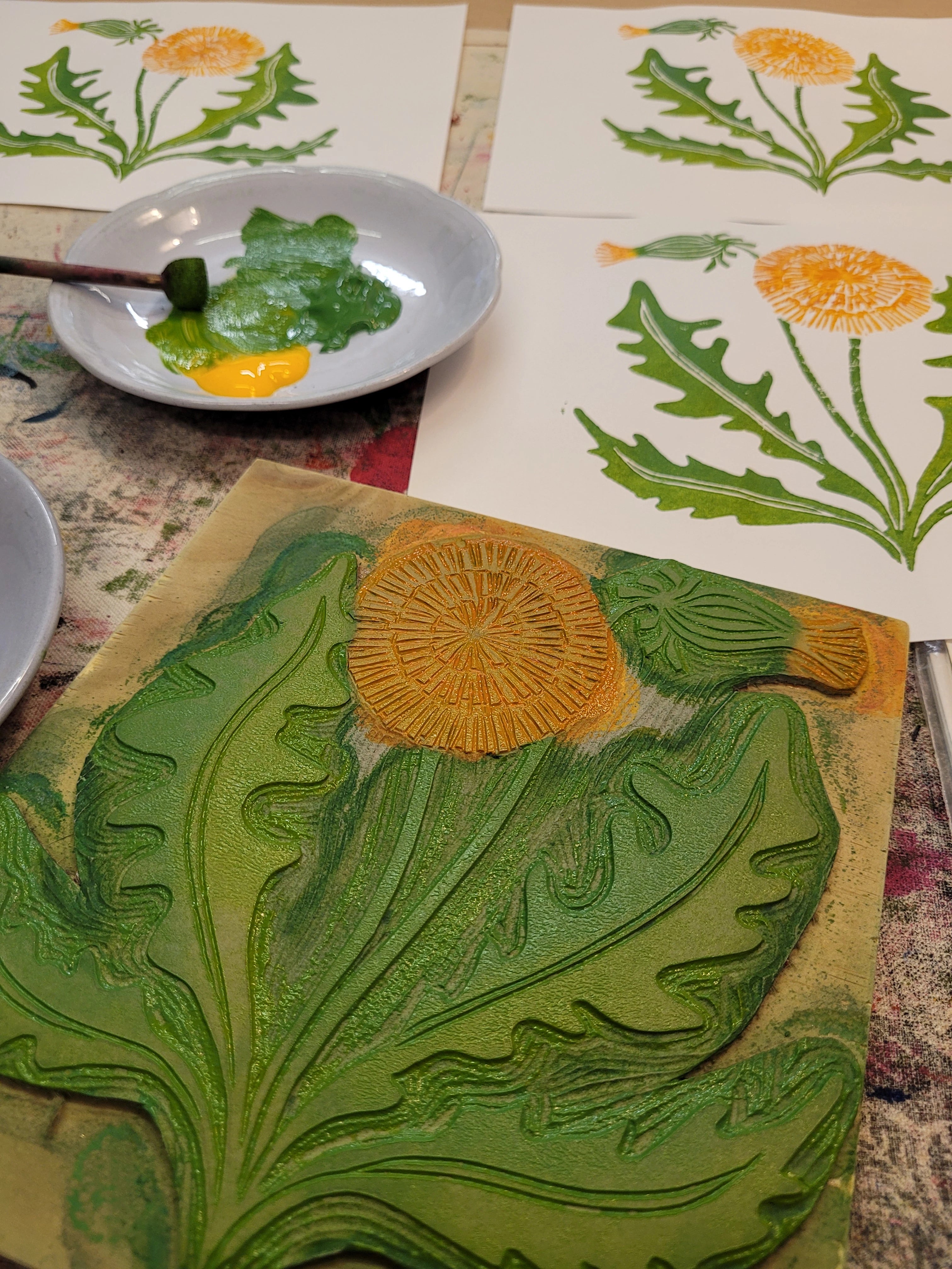dandelion lino blocks being inked up ready to print fabric designed by lizzie mabley