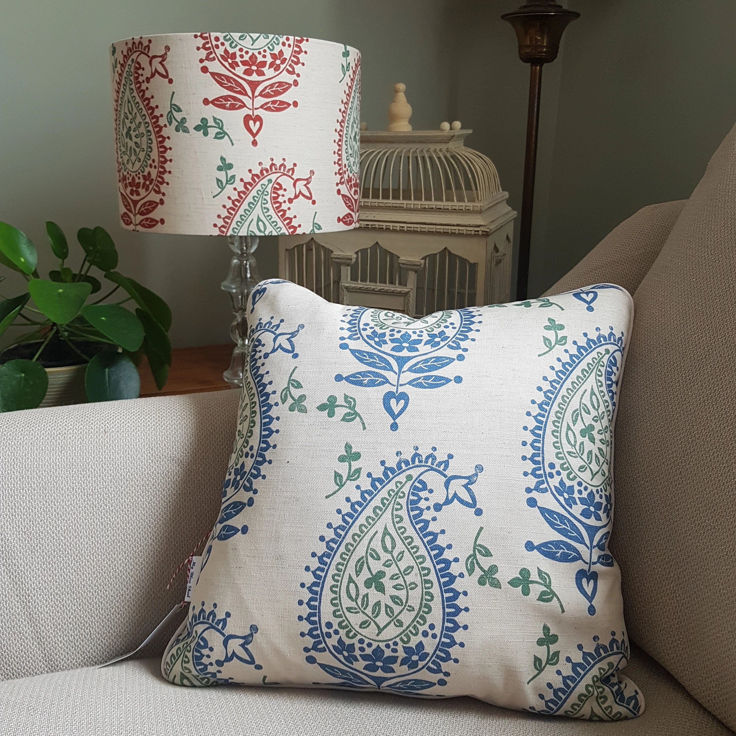 josephine lino block printed fabric designed by lizzie mabley made into a cushion and a lampshade