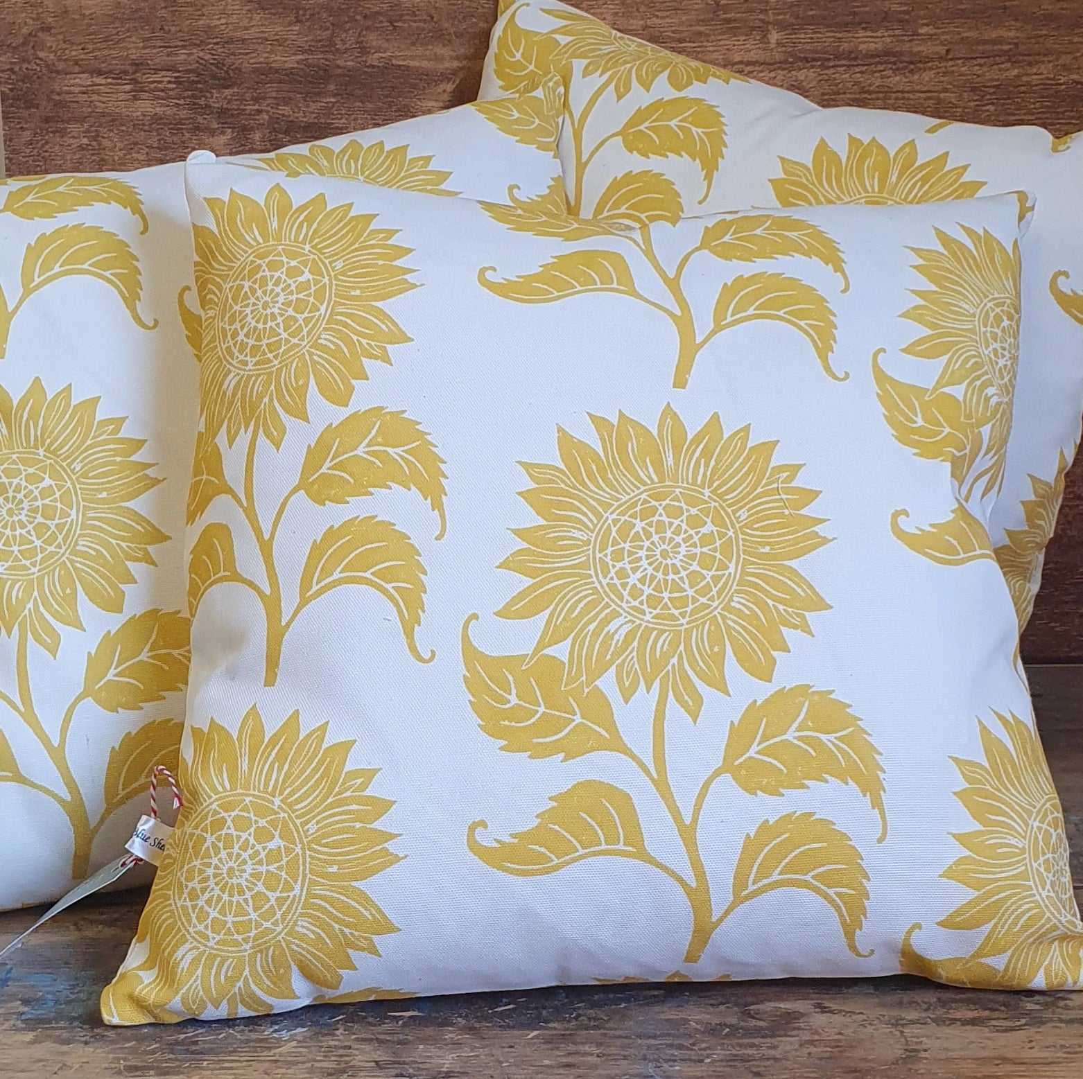 Sunflower lino block printed fabric cushions designed by lizzie mabley
