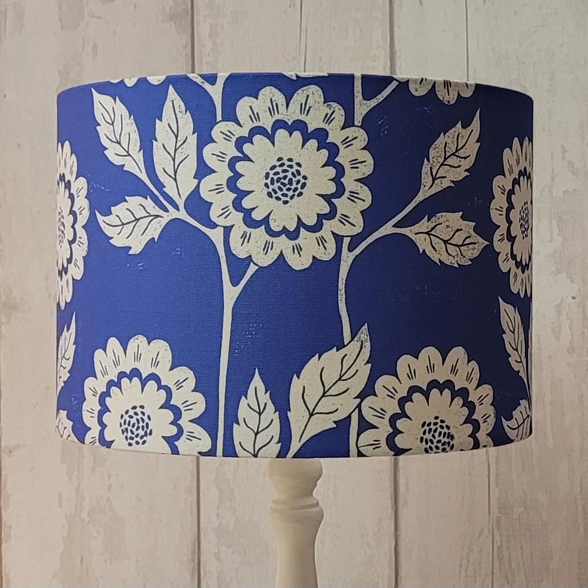 cecilia lino block printed fabric designed by lizzie mabley and made into a blue lampshade