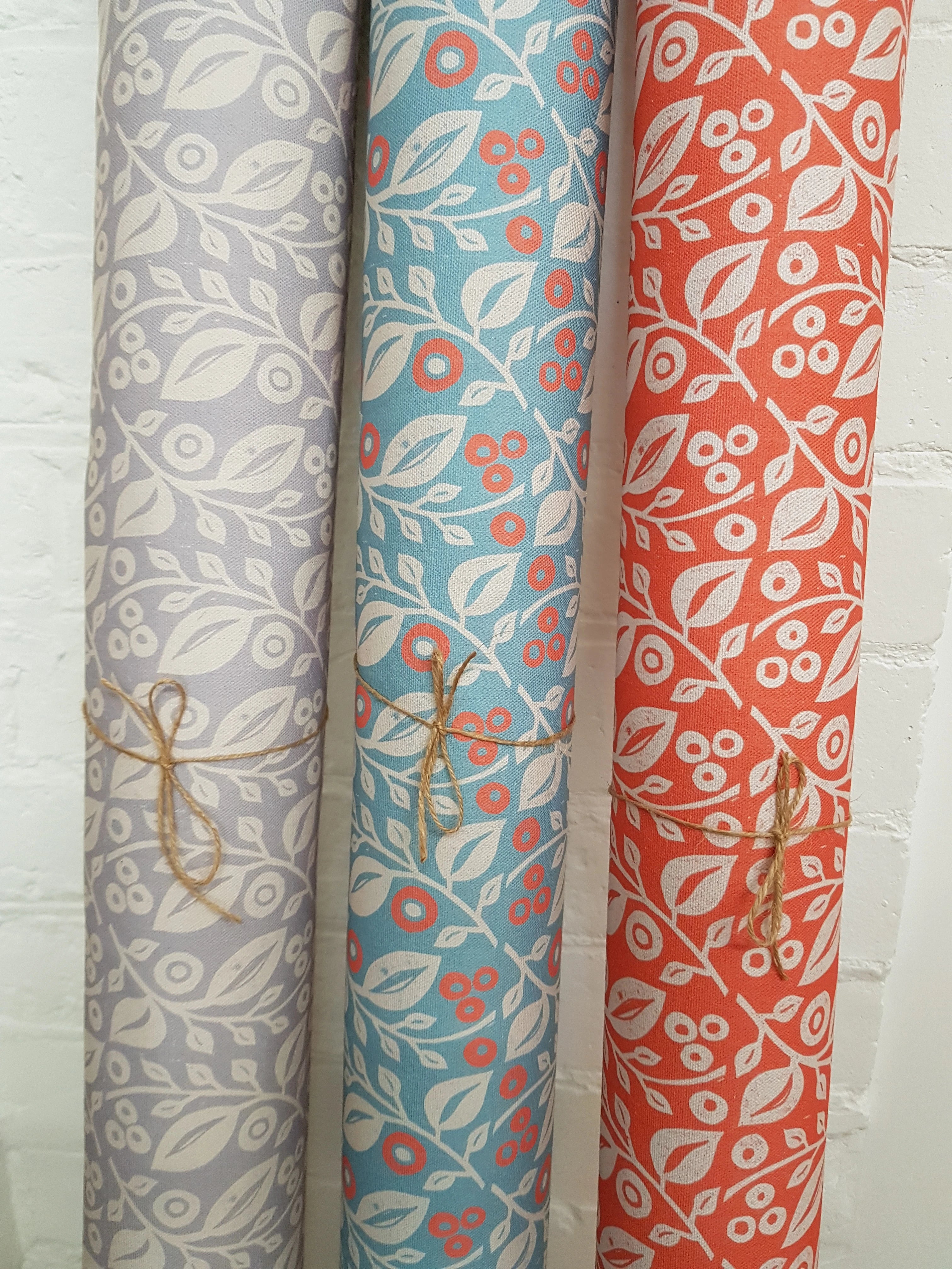 three rolls of lucy lino block printed fabric designed by lizzie mabley