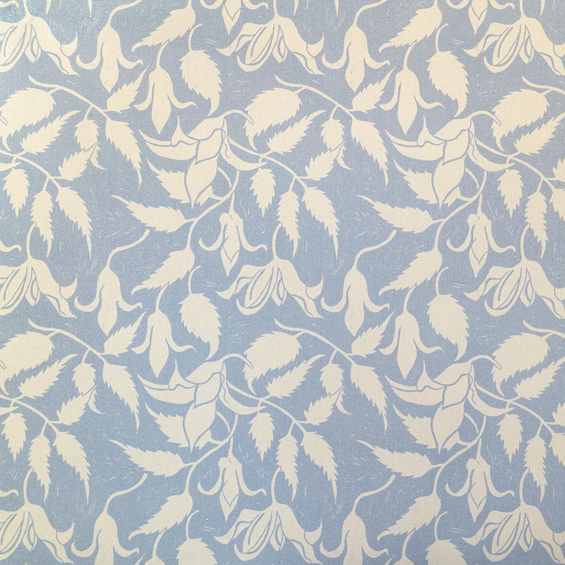 Cream on Blue Alpina lino block printed fabric designed by Lizzie Mabley