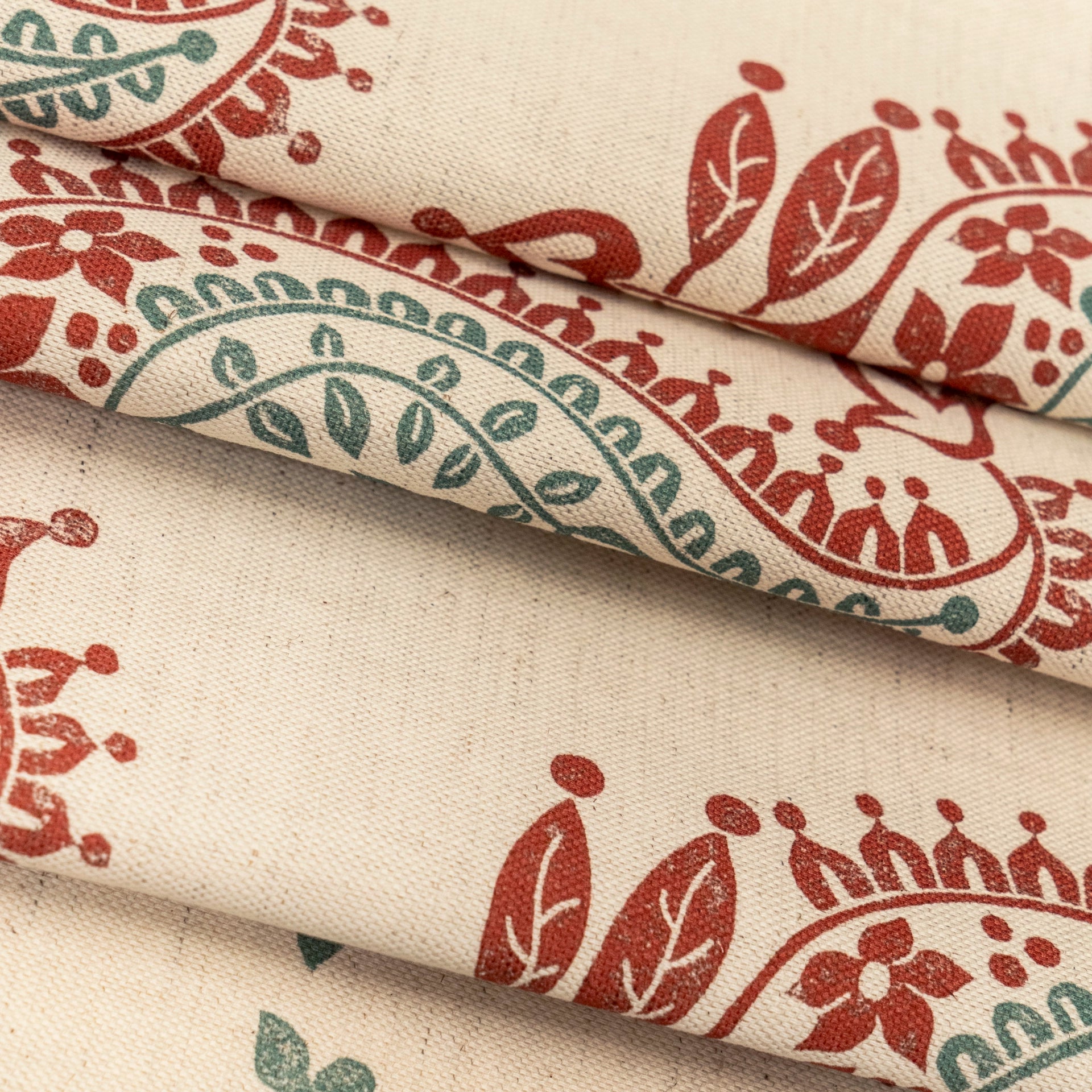 Red and Green Josephine lino block printed fabric designed by Lizzie Mabley