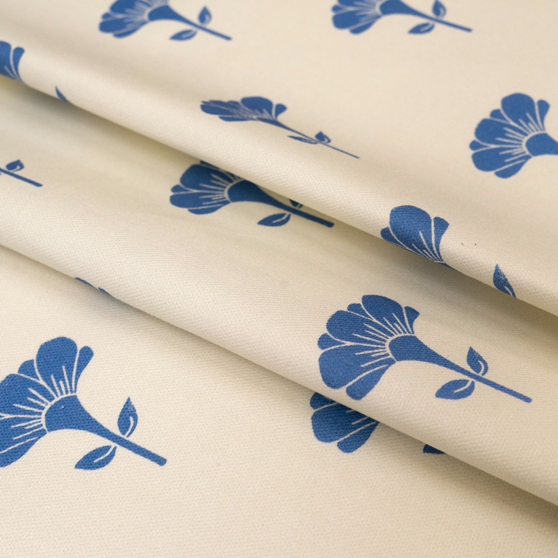 Blue Marigold lino block printed fabric designed by Lizzie Mabley