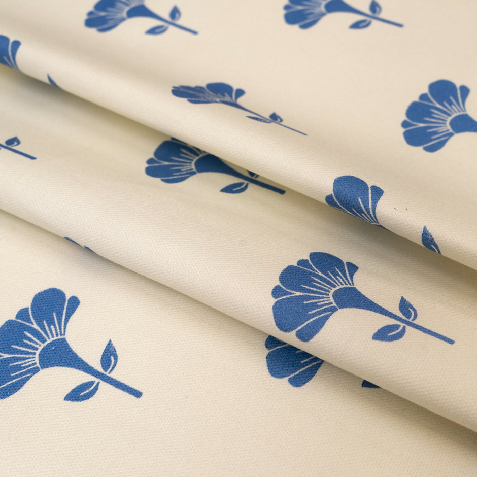 Blue Marigold lino block printed fabric designed by Lizzie Mabley