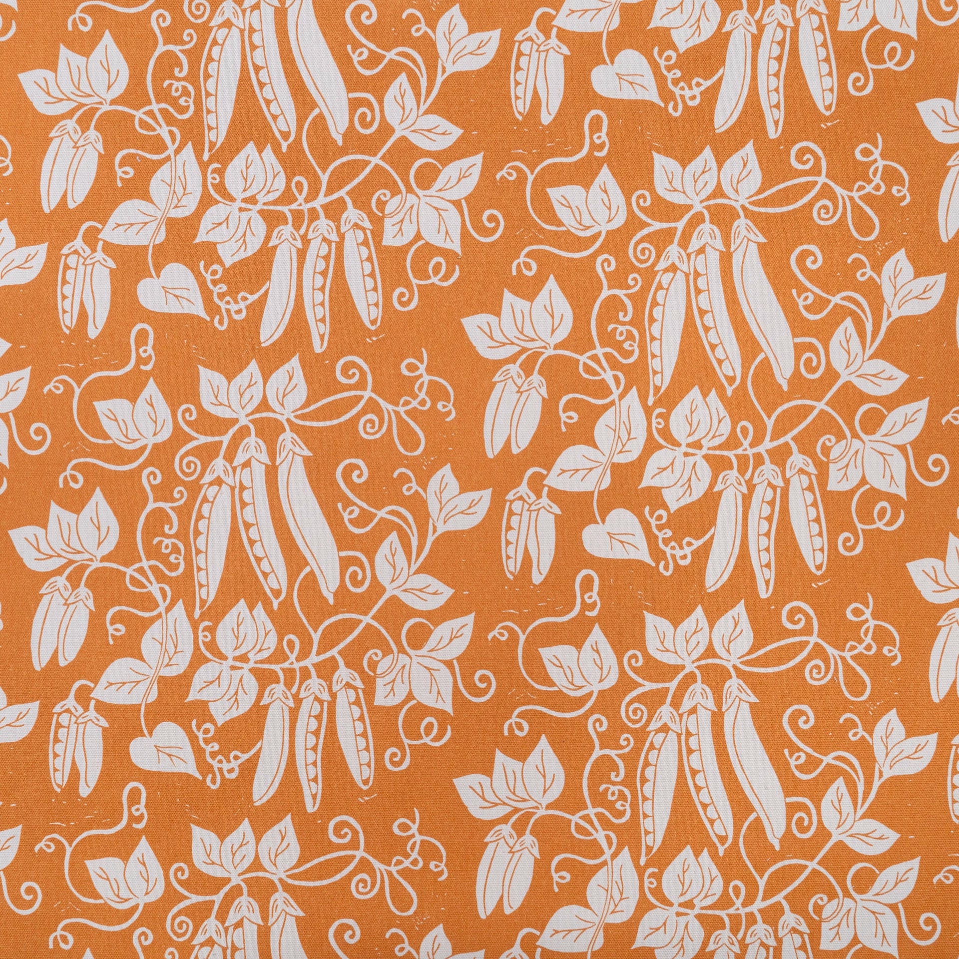 Pumpkin Orange Peas lino block printed fabric designed by Lizzie Mabley
