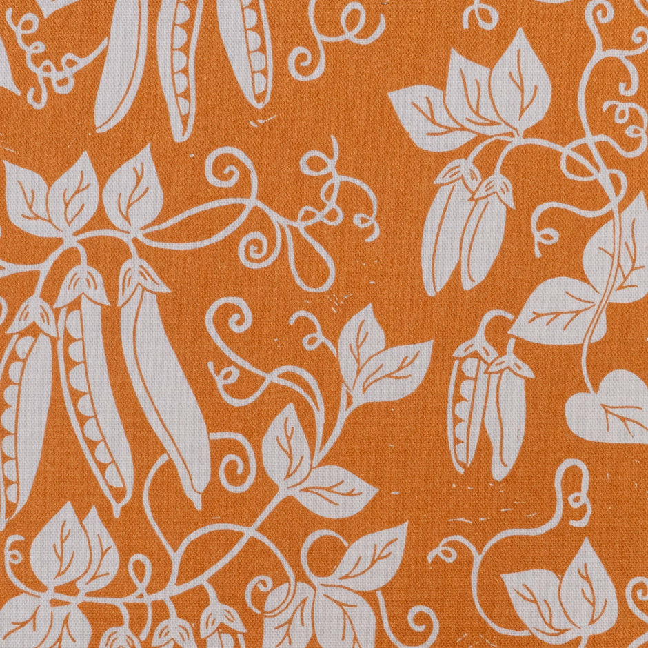 Pumpkin Orange Peas lino block printed fabric designed by Lizzie Mabley