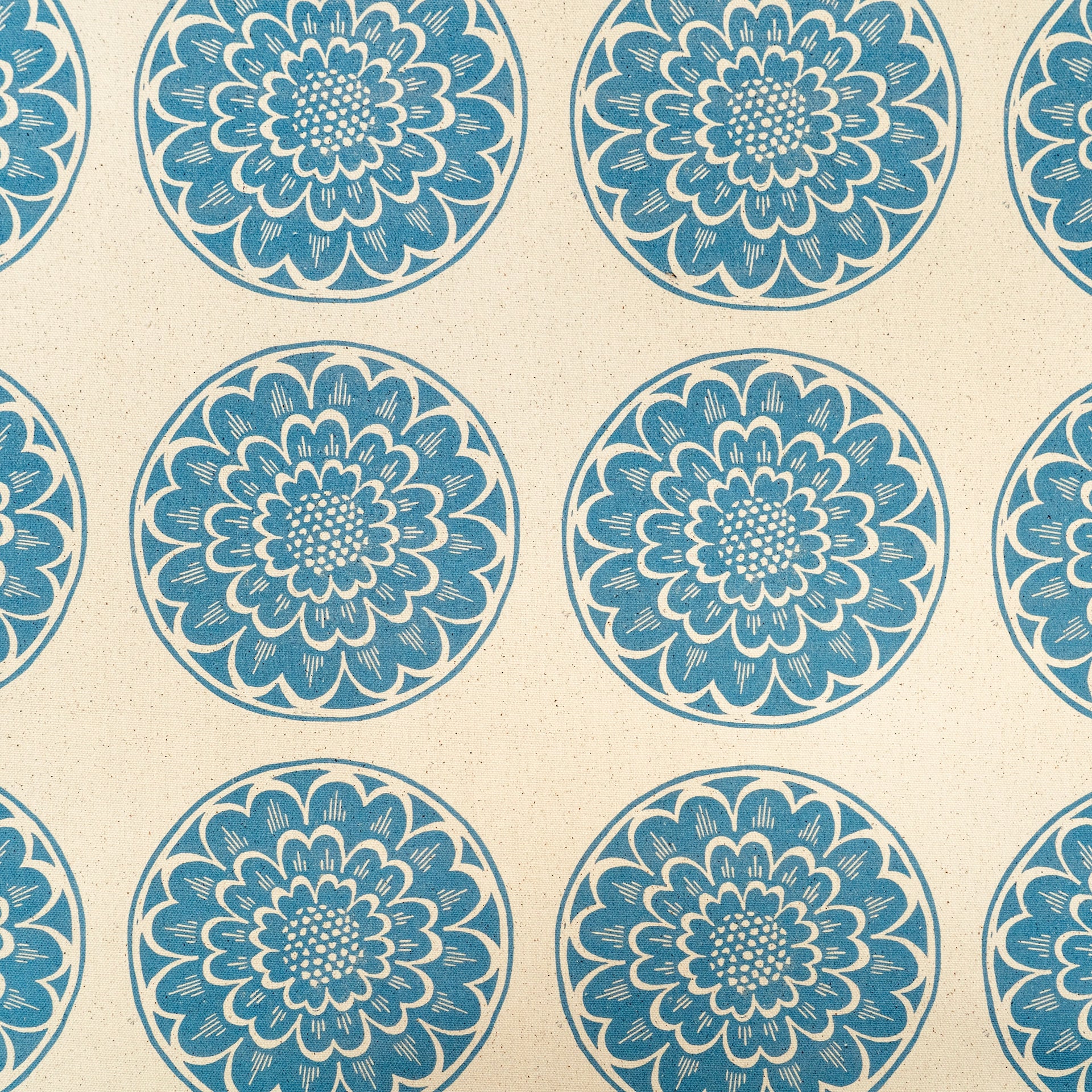 Blue Rosette lino block printed fabric designed by Lizzie Mabley