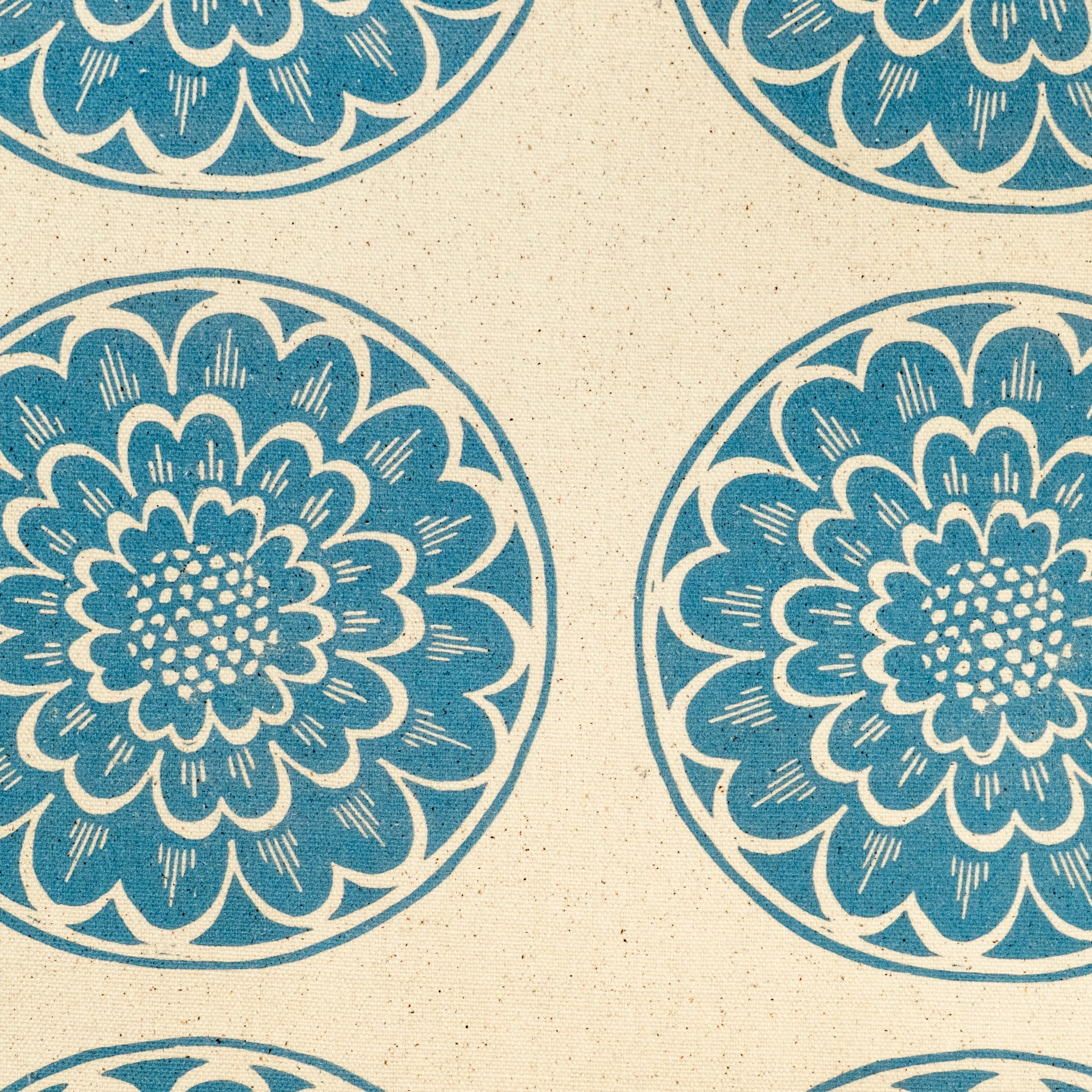 Blue Rosette lino block printed fabric designed by Lizzie Mabley