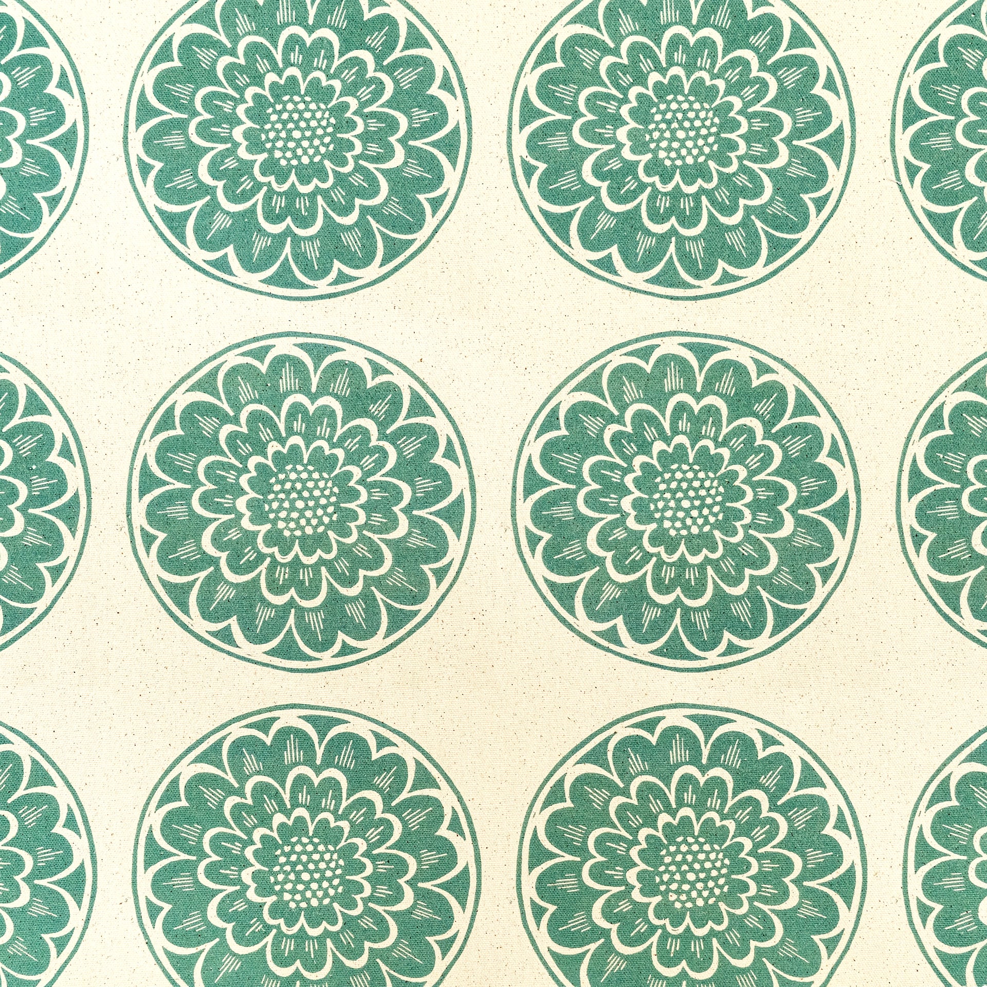 Green Rosette lino block printed fabric designed by Lizzie Mabley