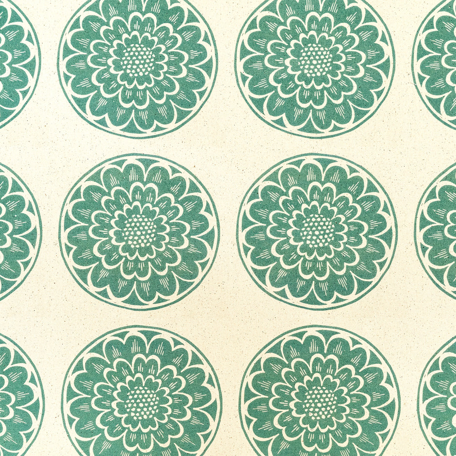 Green Rosette lino block printed fabric designed by Lizzie Mabley