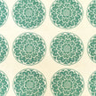 Green Rosette lino block printed fabric designed by Lizzie Mabley