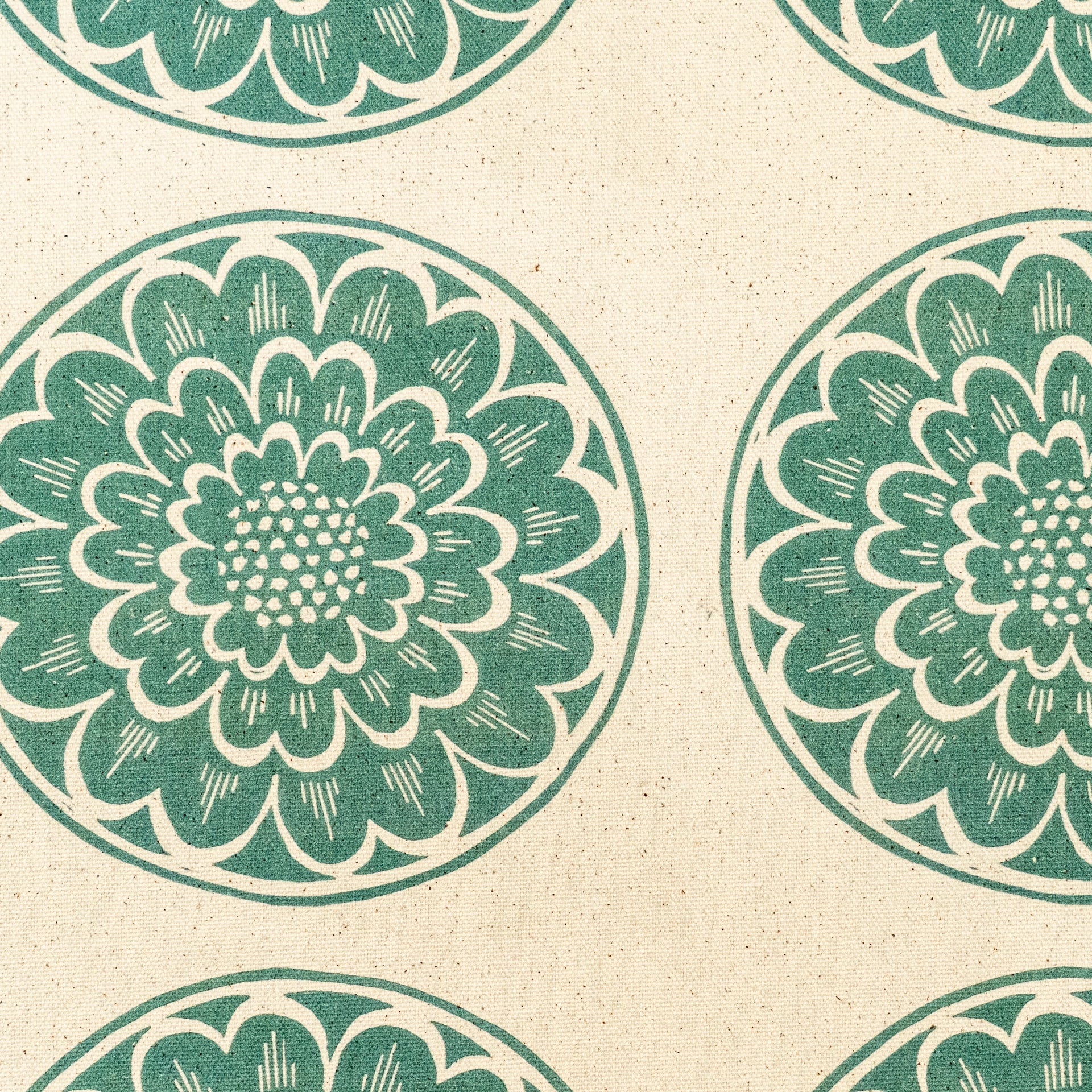 Green Rosette lino block printed fabric designed by Lizzie Mabley