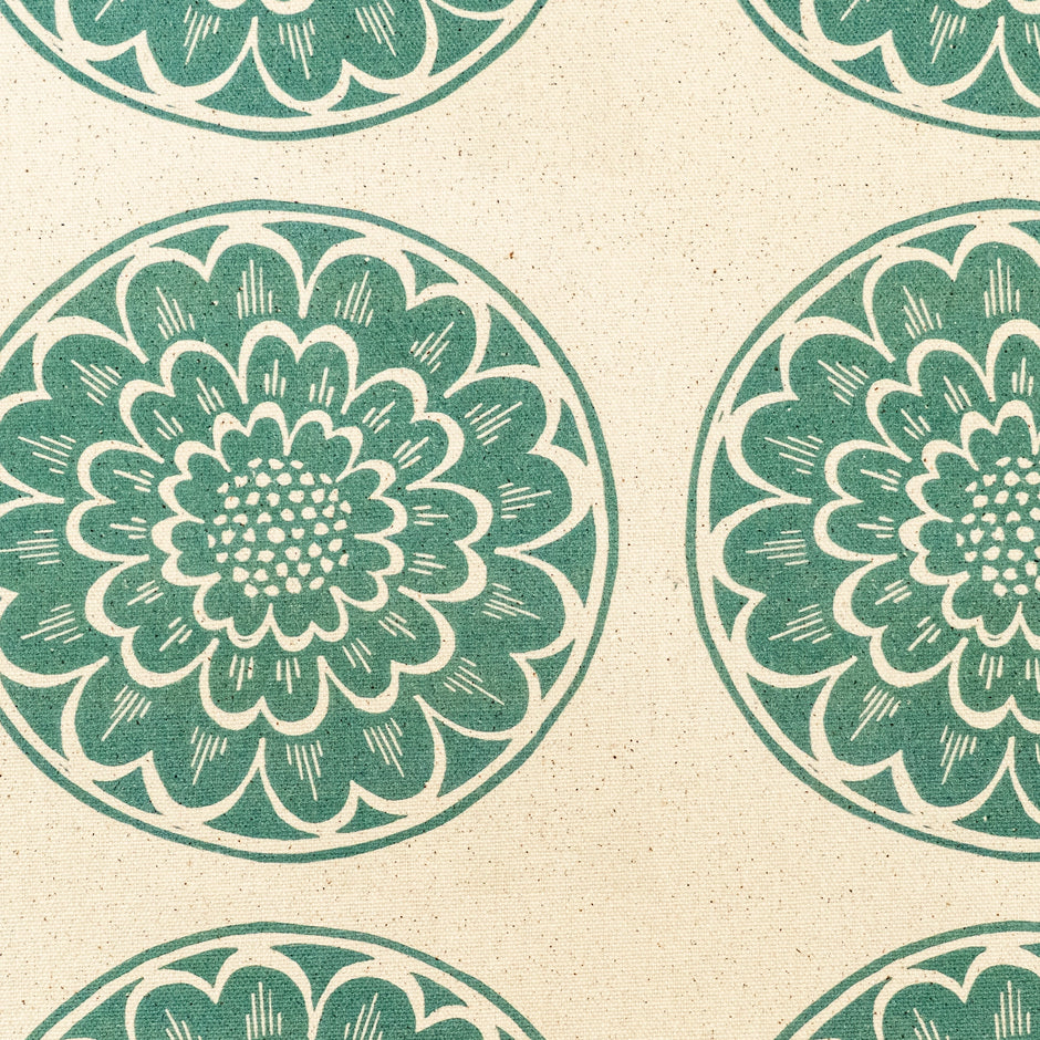 Green Rosette lino block printed fabric designed by Lizzie Mabley