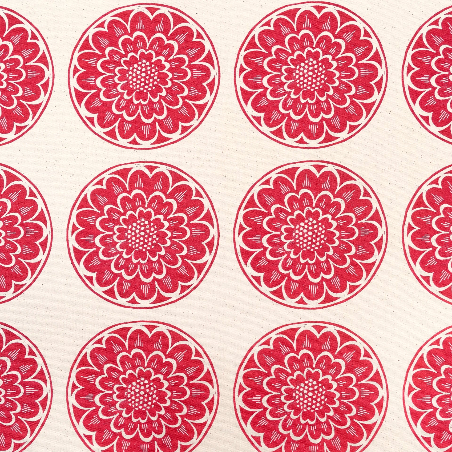 Red Rosette lino block printed fabric designed by Lizzie Mabley