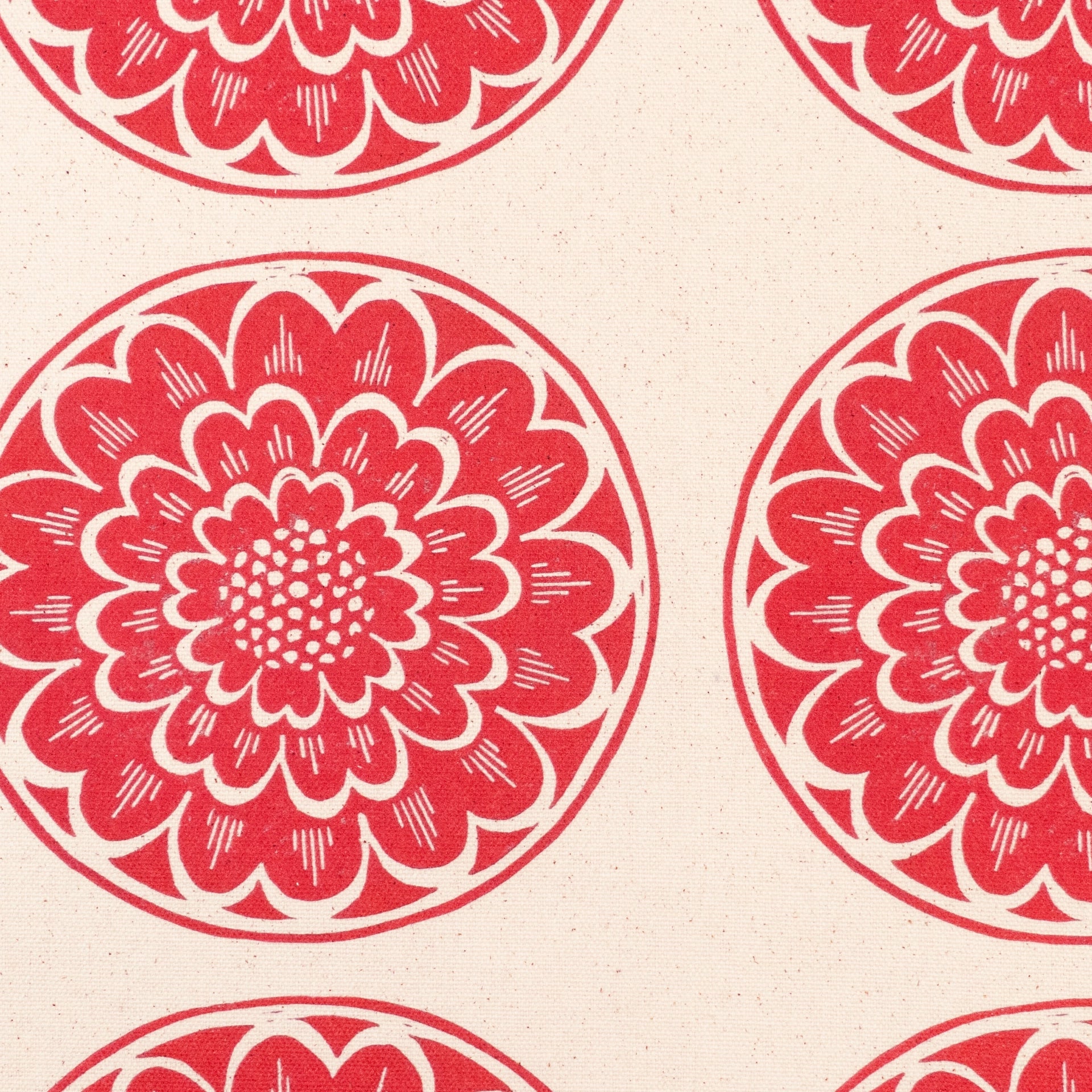 Red Rosette lino block printed fabric designed by Lizzie Mabley