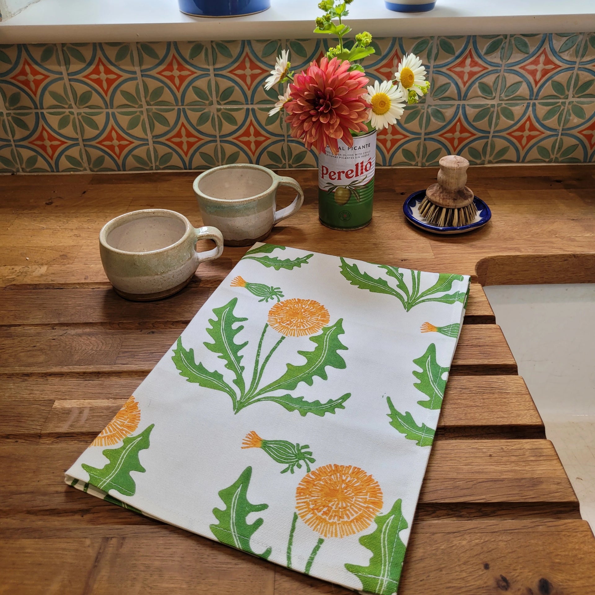 Dandelion lino block printed fabric tea towel designed by Lizzie Mabley