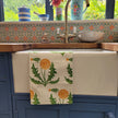 Dandelion lino block printed fabric tea towel designed by Lizzie Mabley