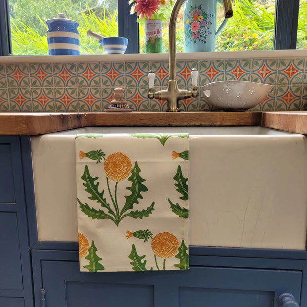 Dandelion lino block printed fabric tea towel designed by Lizzie Mabley