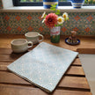 Powder Blue Rebecca lino block printed fabric tea towel designed by Lizzie Mabley