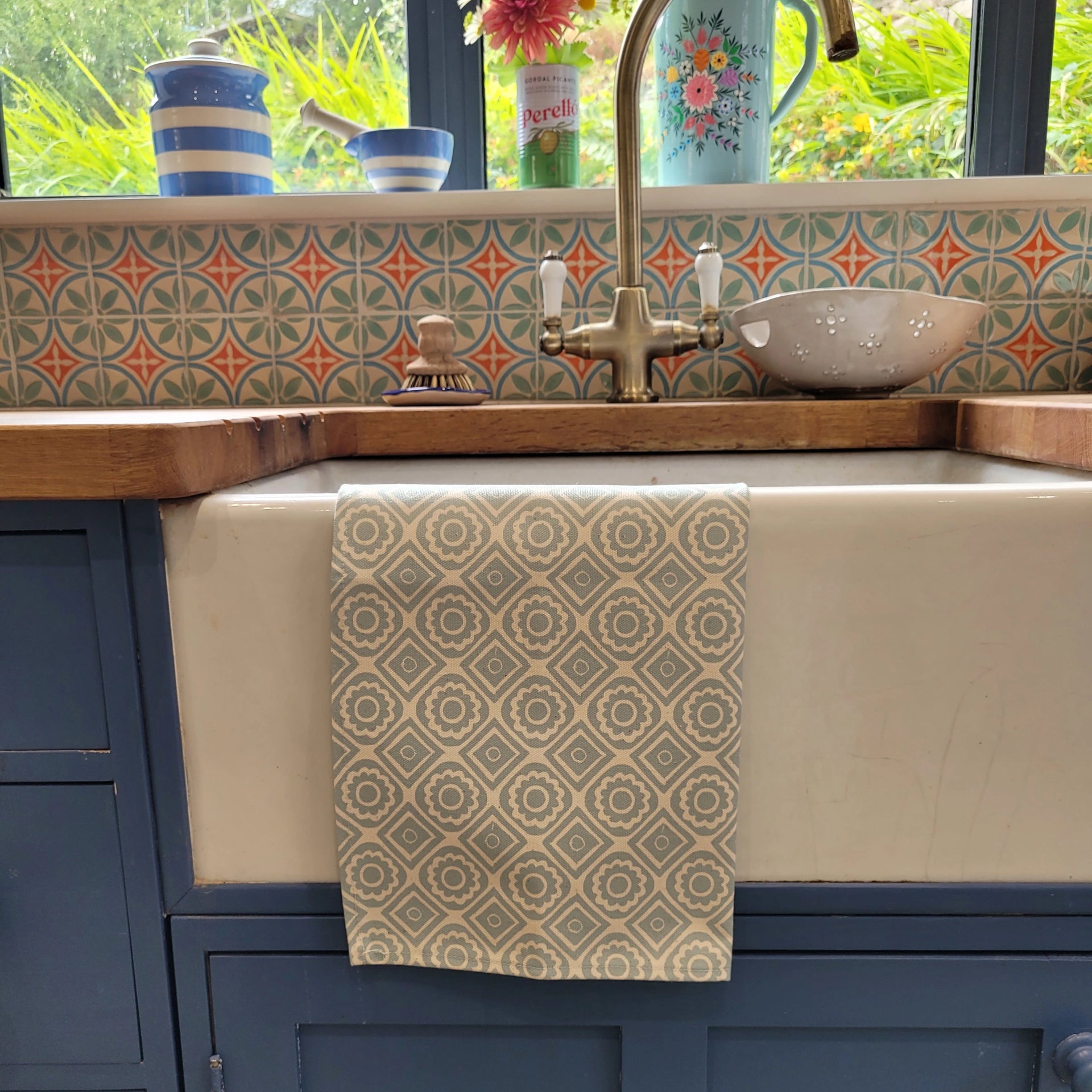 Powder Blue Rebecca lino block printed fabric tea towel designed by Lizzie Mabley