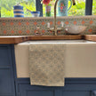Powder Blue Rebecca lino block printed fabric tea towel designed by Lizzie Mabley