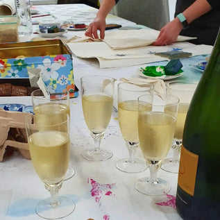 prosecco and cakes whilst Lizzie mabley teaches a lino block printing workshop in her studio