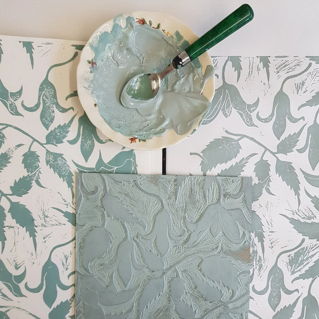 inking lino blocks and printing alpina design by lizzie mabley