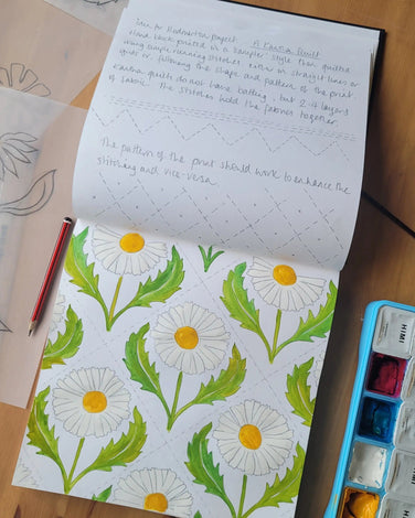 Lizzie mabley designing fabrics in her sketch book