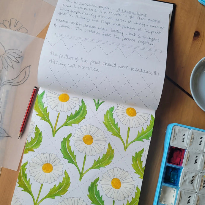 Lizzie mabley designing fabrics in her sketch book